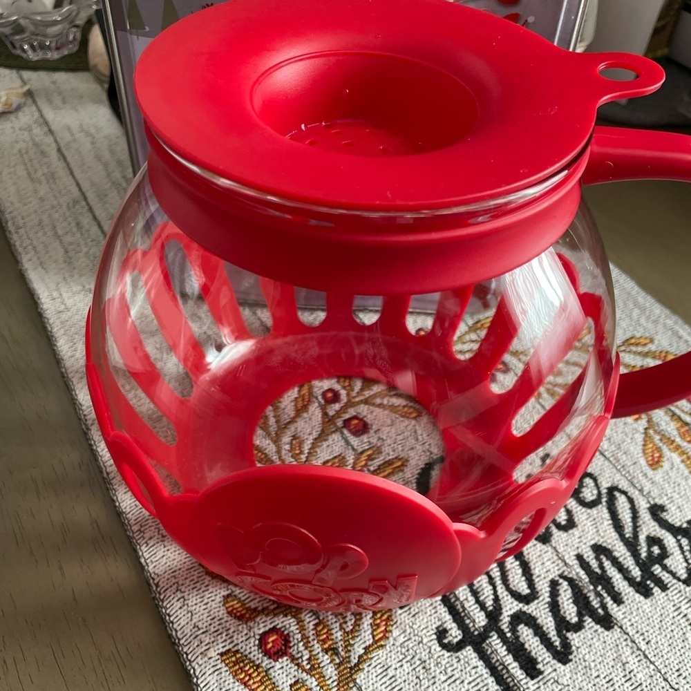 Glass microwave popcorn popper , gently used if used at all , holds a large bowl